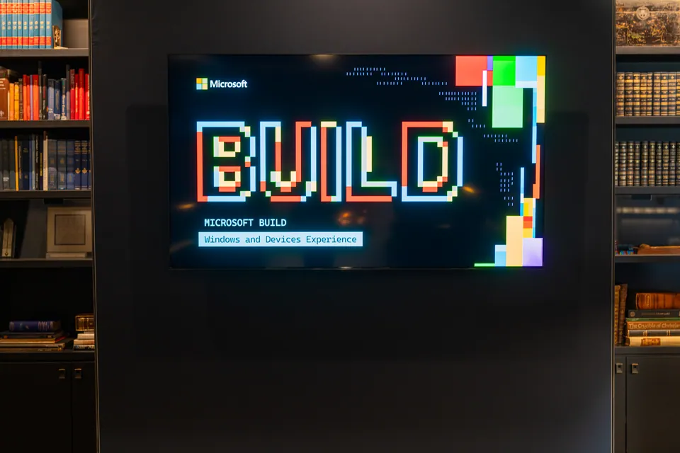 Event branding displayed on screen at a developer conference.
