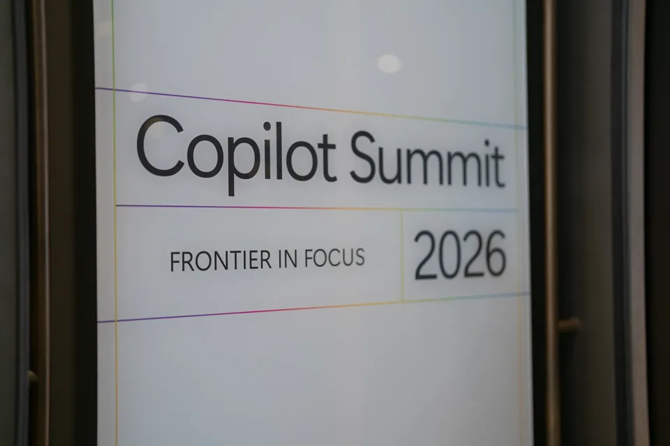 A frosted glass panel reading 'Copilot Summit - Frontier in Focus 2026'.