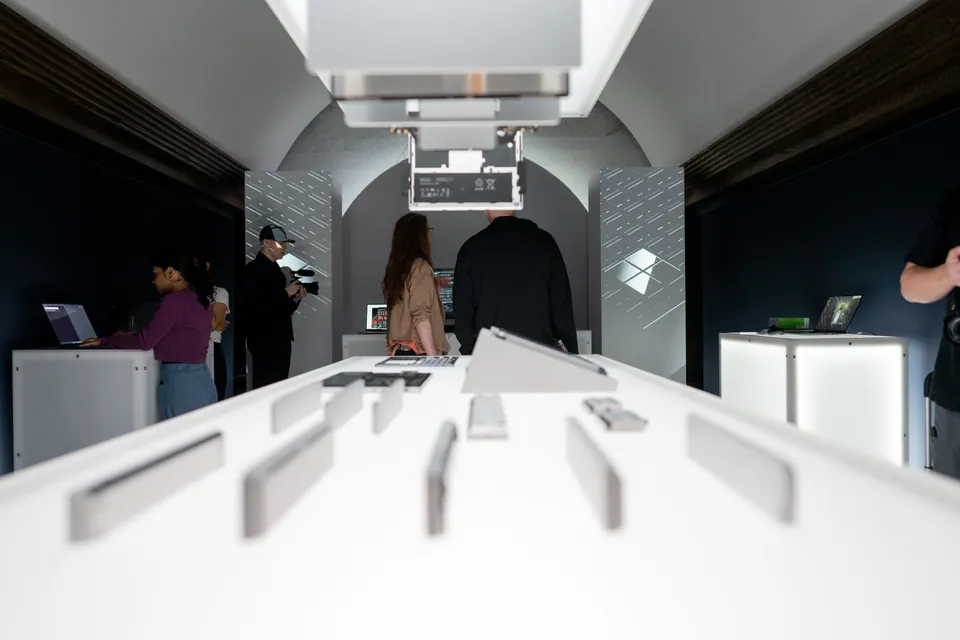 An immersive product corridor with illuminated plinths.